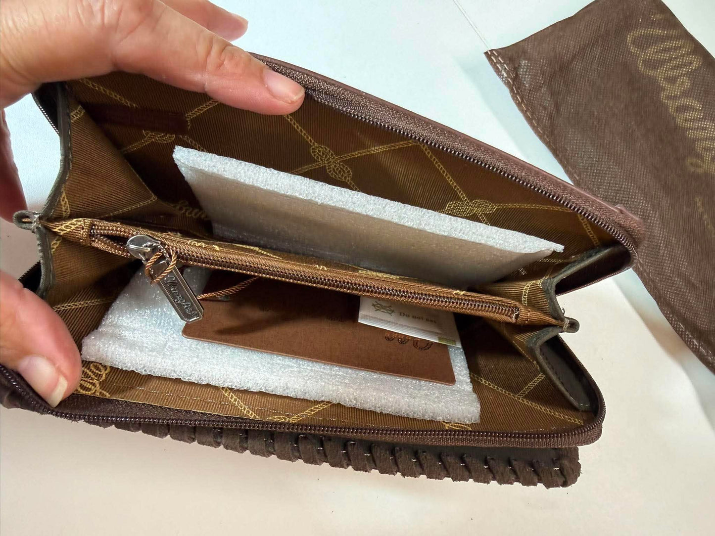 Wrangler cowboy-print wallet.